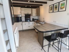 A kitchen with a countertop and appliances at Candle Croft in Tolgus Mount near Redruth