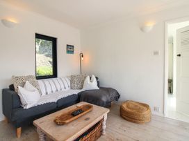 A living room with a sofa and coffee table at West Island in Kingsbridge
