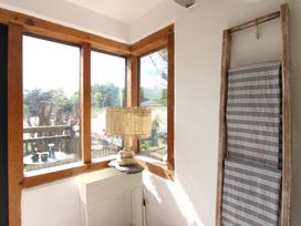 A corner with a lamp and shelf at West Island in Kingsbridge