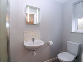 A bathroom with a sink and toilet at Sunny Cottage in Brecon