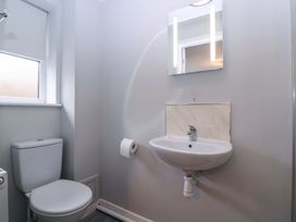 A bathroom with a toilet and sink at Sunny Cottage in Brecon
