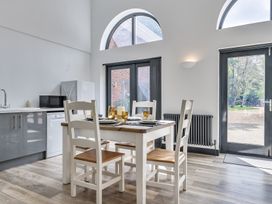 A kitchen with a table and chairs at The Annex in Wimborne Minster