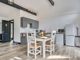 A kitchen with a table and chairs at The Annex in Wimborne Minster