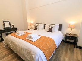 A bedroom with a bed and bedside tables at The Annex in Wimborne Minster
