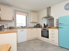 A kitchen with modern appliances at The Lookout in Polzeath