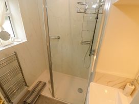 A bathroom with a shower and sink at North Studdock Cottage Angle near Pembroke