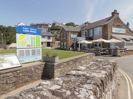 A building with outdoor seating at Little Haven Castle