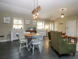 A living room with a table and chairs at The Old Tannery Beaumaris