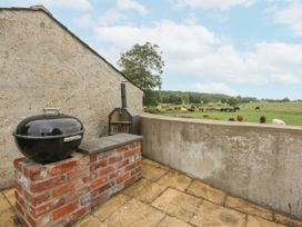 An outdoor area with a barbecue and a cooking grill at The Old Tannery Beaumaris