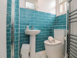 A bathroom with a sink, toilet, and shower at Wellington House in Bridlington