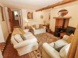 A living room with sofas and a fireplace at White House in Shap