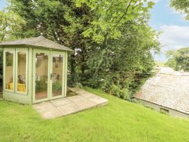A summerhouse in a garden at White House in Shap