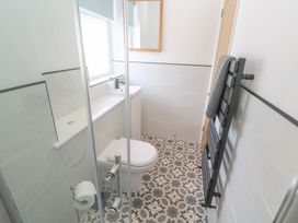 A bathroom with a toilet and sink at Foundry Cottage In Hayle Harbour, Hayle