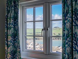 A window with a view of landscape and houses at Waders in Salcombe