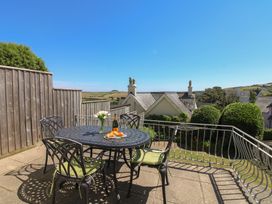 A table with drinks and pastries in an outdoor area at Waders in Salcombe
