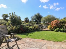 A garden with flowers and trees at Wayside near Kingsbridge