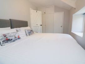 A bedroom with a bed and pillows at Wayside near Kingsbridge