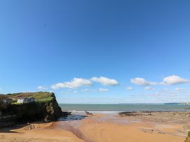 A beach with cliffs and water at Wayside near Kingsbridge