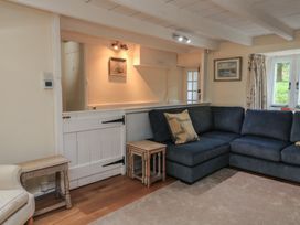 A living room with a sofa and side table at Wayside near Kingsbridge