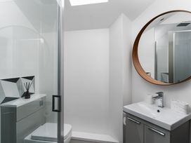 A bathroom with a shower and sink at Estuary Watch Lelant near Carbis Bay