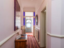 A hallway with a front door and a lamp at 50 West Street Edelweiss Scarborough