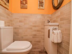 A bathroom with a sink and toilet at 50 West Street Edelweiss in Scarborough