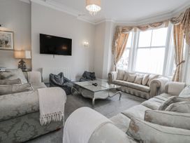 A living room with a sofa and coffee table at The Keep in Llandudno