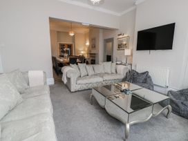 A living room with a sofa and coffee table at The Keep in Llandudno