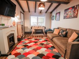 A snug with a sofa and foosball table at The Keep in Llandudno
