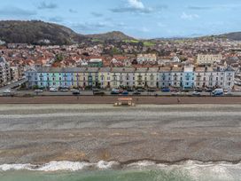 A seaside view with buildings and cars at The Keep in Llandudno