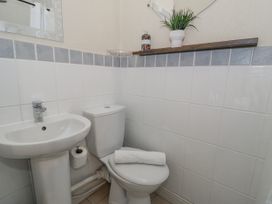 A bathroom featuring a sink and toilet at The Keep in Llandudno