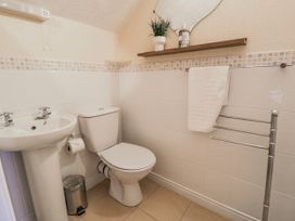 A bathroom with sink and toilet at The Keep in Llandudno