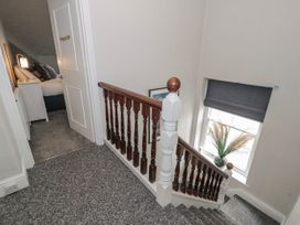 A staircase leading to a bedroom at The Keep in Llandudno