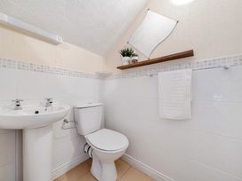 A bathroom with a sink and toilet at The Keep in Llandudno