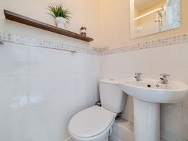 A bathroom with a toilet and sink at The Keep in Llandudno