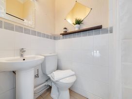 A bathroom with sink and toilet at The Keep in Llandudno