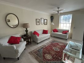 A living room with sofas and a coffee table at The White House in Torquay