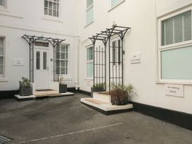 An outdoor area with entrances and signage at The White House in Torquay