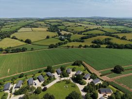 An aerial view of fields and buildings at 2 Faraway Fields in Dobwalls