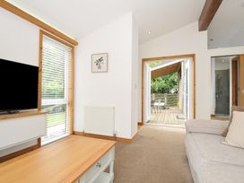 A living room with a television and a coffee table at 3 Southern Place in Dobwalls
