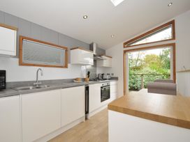 A kitchen with appliances and a window at 3 Southern Place in Dobwalls