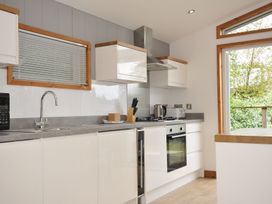 A kitchen with a stove and sink at 3 Southern Place in Dobwalls