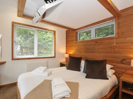 A bedroom with a bed and decorative pillows at 3 Southern Place in Dobwalls