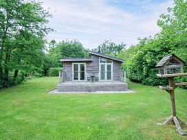 A house with a deck and bird feeder at 5 Faraway Fields in Dobwalls