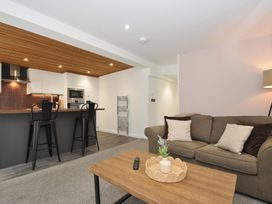 A living room with a sofa and coffee table at 24 Meadow Retreat in Dobwalls