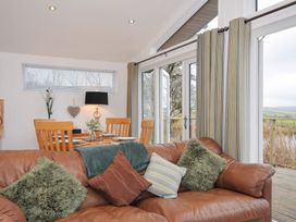 A dining room with a table and chairs at 15 Faraway Fields Dobwalls