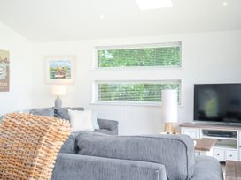 A living room with a sofa and television at 1 Horizon View in Dobwalls