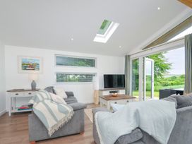 A living room with a sofa and television at 1 Horizon View in Dobwalls