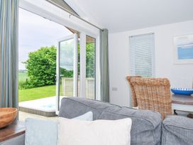 A living room with a view of the garden at 1 Horizon View Dobwalls