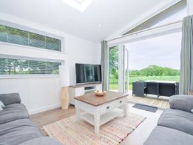 A living room featuring a sofa and television at 1 Horizon View in Dobwalls